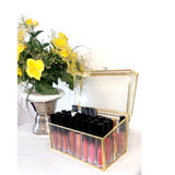 lipstick storage box with lid that is open and lipsticks inside the box