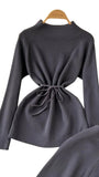 black-knitted-top-with-slim-belt-around-waist